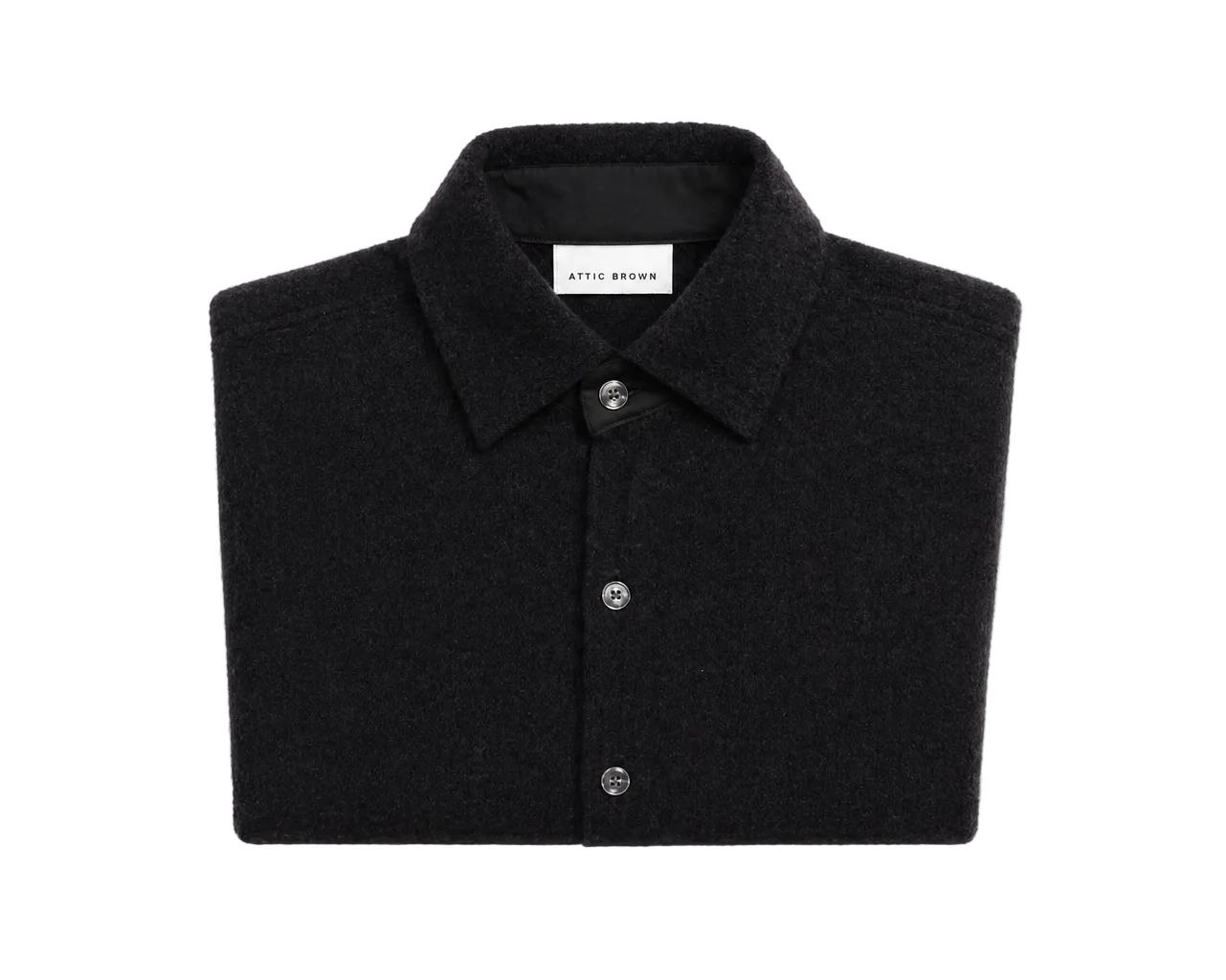 Folded black shirt with a brand label on a light gray background